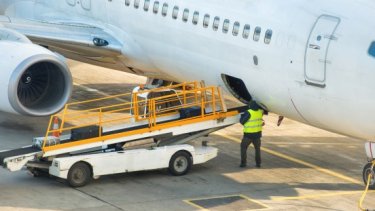IAE blog image of a man loading luggage to aircraft