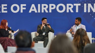 A speaker in front of attendees