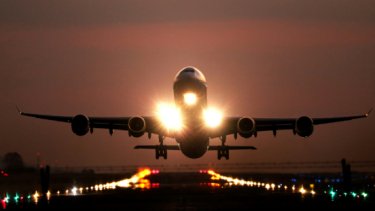 IAE25 press release image of an airplane landing at sunset