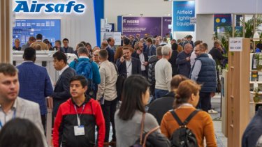 IAE25 press release image of the crowded trade show floor