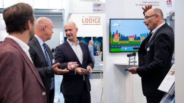 IAE25 press release image of exhibitors at the show