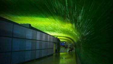 IAE blog image of an airport hallway with green lighting