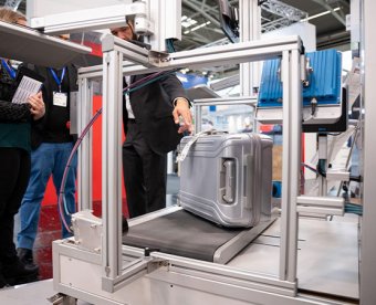 Exhibitor showing a product to a visitor at inter airport Europe